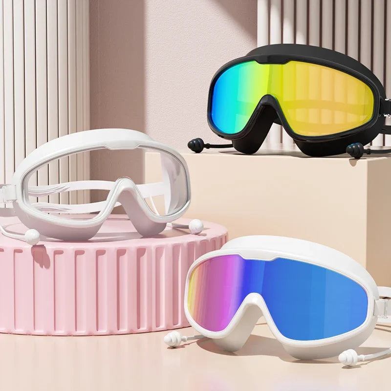Anti-Fog Wide View Swimming Goggles – UV Protection & Earplugs Included