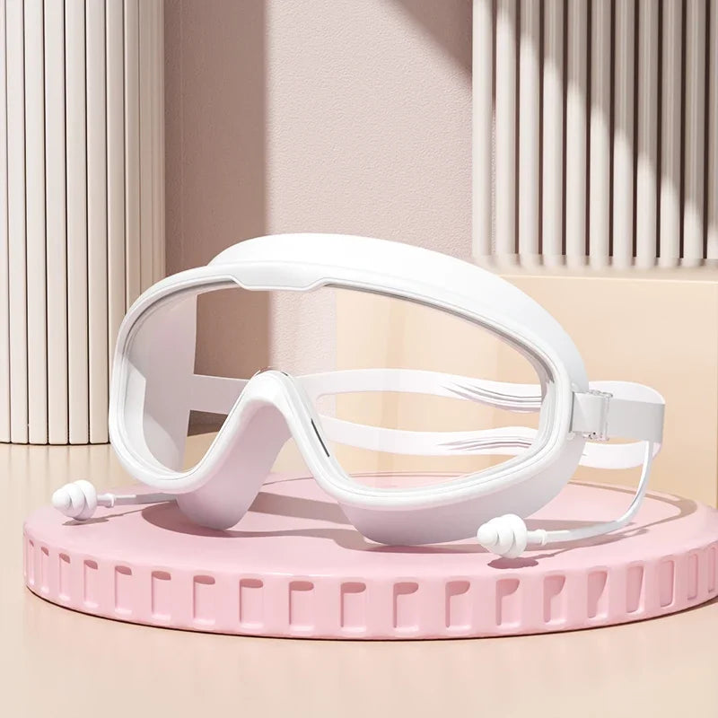 Anti-Fog Wide View Swimming Goggles – UV Protection & Earplugs Included