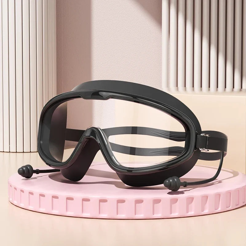 Anti-Fog Wide View Swimming Goggles – UV Protection & Earplugs Included